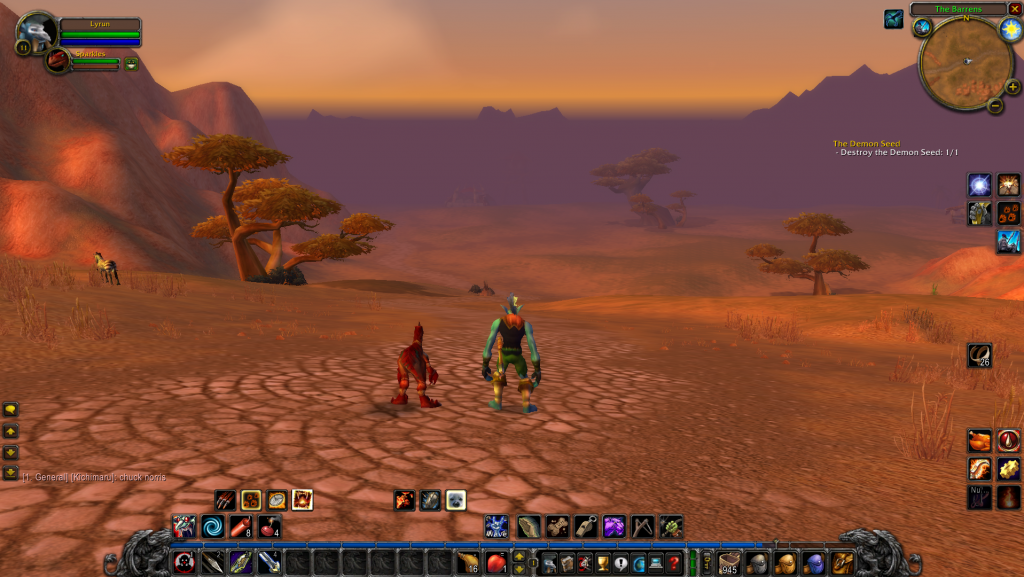 A World of Warcraft screenshot shows a player character named Lyrun standing on cracked, dry earth in the Barrens, accompanied by a small pet named Sparkles. The landscape is a warm orange savanna with sparse trees and distant hills under a sunset‑colored sky. The game interface displays Lyrun’s and Sparkles’ health bars in the top left, a minimap labeled “The Barrens” in the top right, and an active quest titled “The Demon Seed” marked as completed. The bottom of the screen shows action bar abilities, while the chat box contains a single message referencing “chuck norris.”